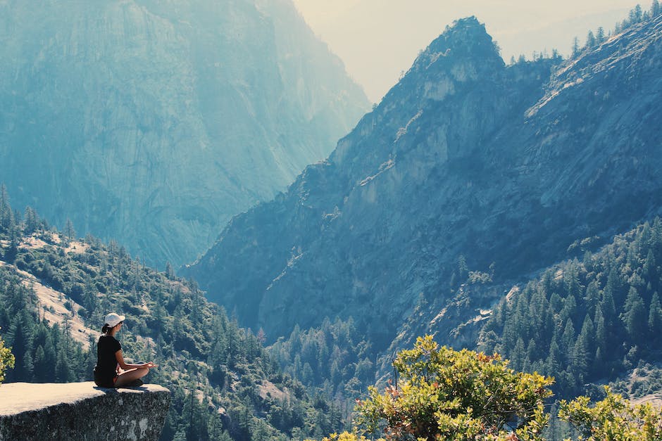 A serene image of someone meditating in a peaceful natural setting, representing the clarity and calm achieved through chiropractic interventions.